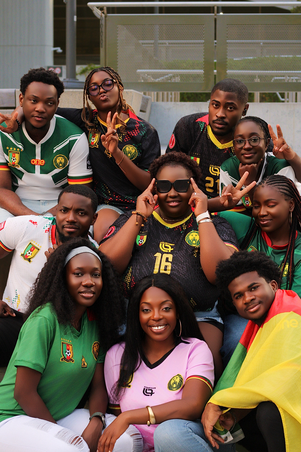 YCA members smiling together in Cameroon jerseys